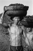 VIETNAM. A few kilometres north of picturesque and frequently visited Ha Long Bay is the coal mining area that tourists rarely see. Hong Gai is the port where coal is shipped from nearby mines, with much of the work done by hand. 2000.
