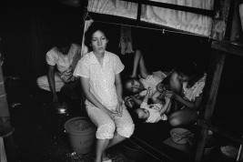 HONG KONG. Mother with her children in a refugee camp. Many spent years living in overcrowded conditions and many were forcibly repatriated to Viet Nam.